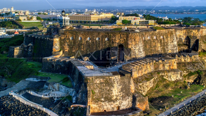 A view of Fort San Felipe del Morro and lighthouse, Old San Juan, sunset Aerial Stock Photo AX104_021.0000000F | Axiom Images