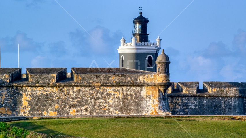 Port San Juan Light and Fort San Felipe del Morro, Old San Juan, sunset Aerial Stock Photo AX104_023.0000000F | Axiom Images