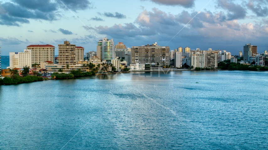 Hotels beside Condado Lagoon, San Juan, Puerto Rico sunset Aerial Stock Photo AX104_060.0000309F | Axiom Images