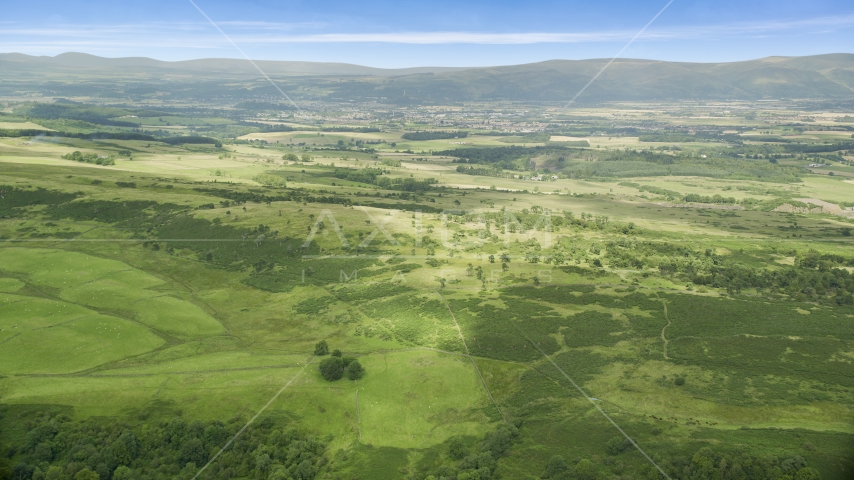 Green farmland and rural landscape, Stirling, Scotland Aerial Stock Photo AX109_006.0000000F | Axiom Images