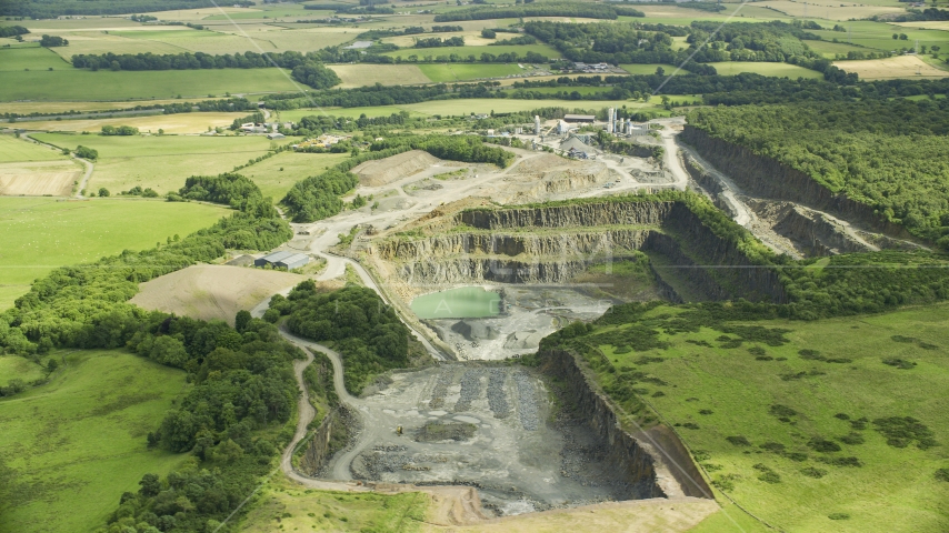 A quarry surrounded by farm fields, Denny, Scotland Aerial Stock Photo AX109_009.0000000F | Axiom Images