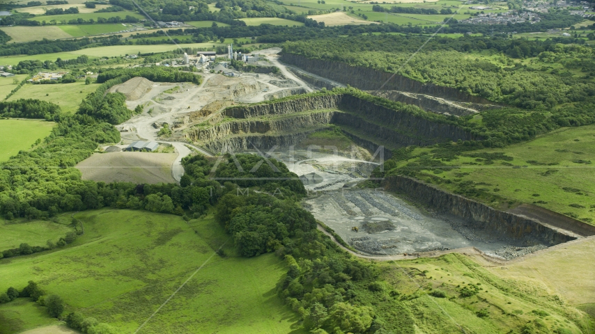 Farmland surrounding a quarry, Denny, Scotland Aerial Stock Photo AX109_009.0000156F | Axiom Images