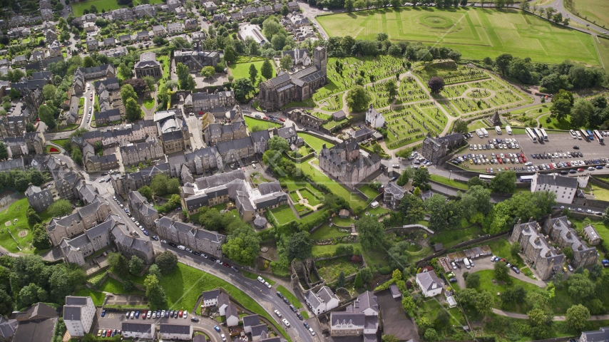 A church and cemetery near residential area, Stirling, Scotland Aerial Stock Photo AX109_027.0000087F | Axiom Images