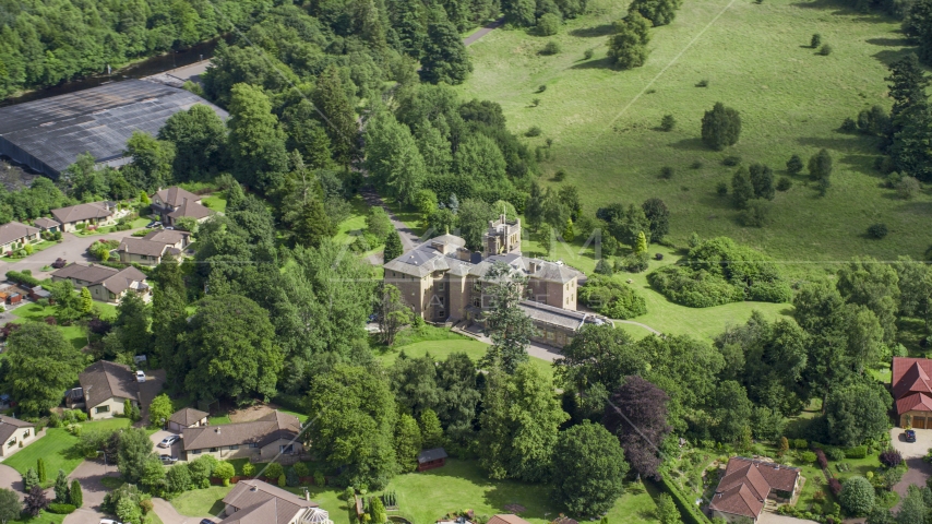 Manor Hall Center for Trauma hospital and neighboring homes, Scotland Aerial Stock Photo AX109_082.0000000F | Axiom Images