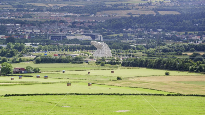 The Kelpies sculptures seen from farmland, Falkirk Scotland Aerial Stock Photo AX109_117.0000128F | Axiom Images