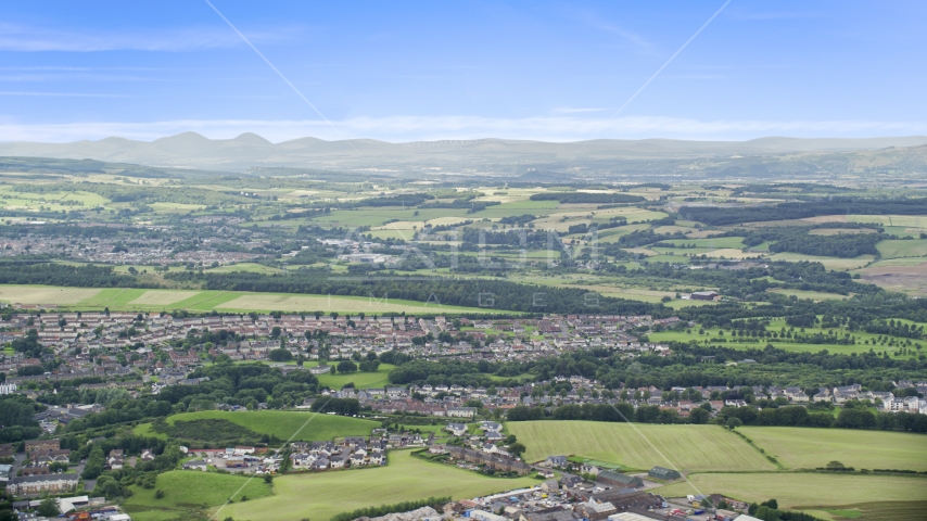 Farmland and a Scottish village, Bonnybridge, Scotland Aerial Stock Photo AX109_166.0000053F | Axiom Images