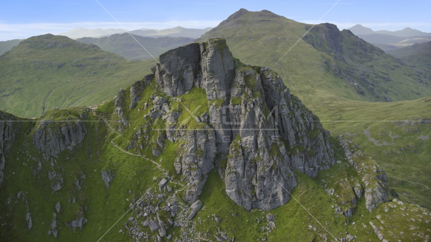 A jagged summit of The Cobbler mountain peak, Scottish Highlands, Scotland Aerial Stock Photo AX110_083.0000000F | Axiom Images