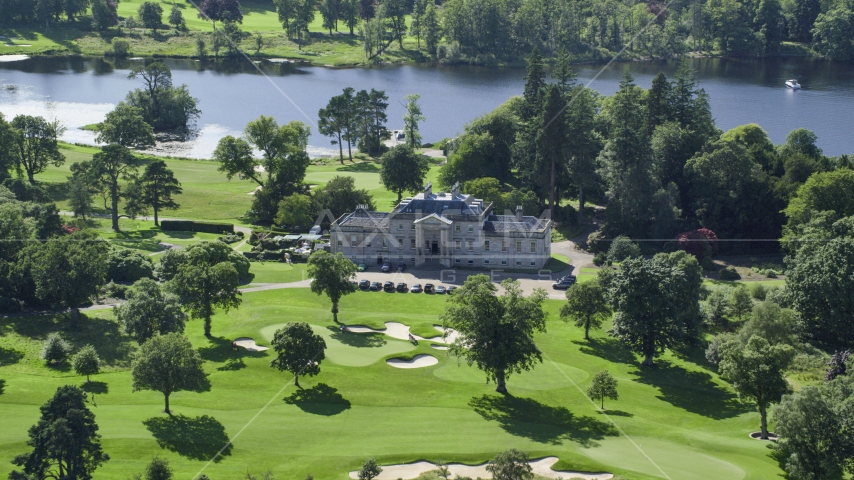 Rossdhu Mansion at Loch Lomond Golf Course in Luss, Scottish Highlands, Scotland Aerial Stock Photo AX110_114.0000229F | Axiom Images