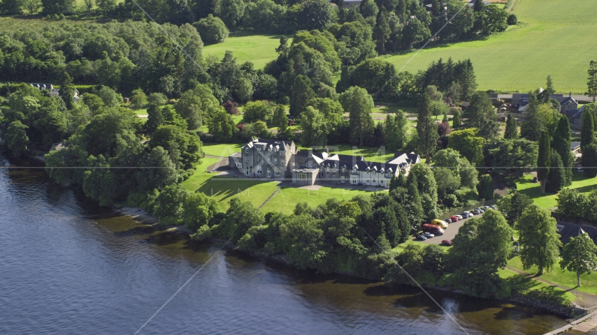 Lomond Castle by Loch Lomond in Arden, Scottish Highlands, Scotland Aerial Stock Photo AX110_126.0000000F | Axiom Images