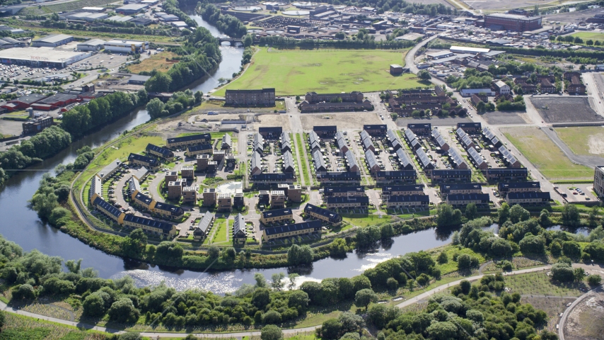 Riverfront row houses along River Clyde, Glasgow, Scotland Aerial Stock Photo AX110_189.0000103F | Axiom Images