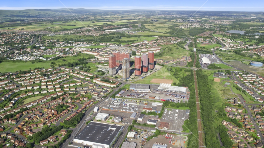 Tall apartment buildings near houses, Glasgow, Scotland Aerial Stock Photo AX110_215.0000046F | Axiom Images