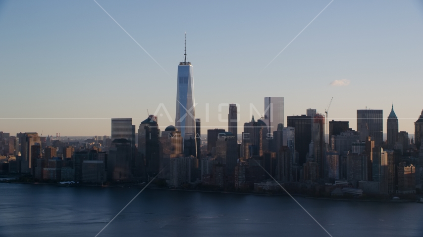 The Lower Manhattan skyline across the Hudson River at sunrise in New York City Aerial Stock Photo AX118_150.0000000F | Axiom Images