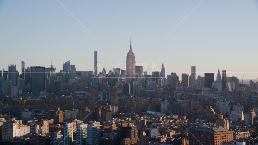 The Empire State Buildings and Midtown skyscrapers at sunrise in New York City Aerial Stock Photo AX118_157.0000074F | Axiom Images