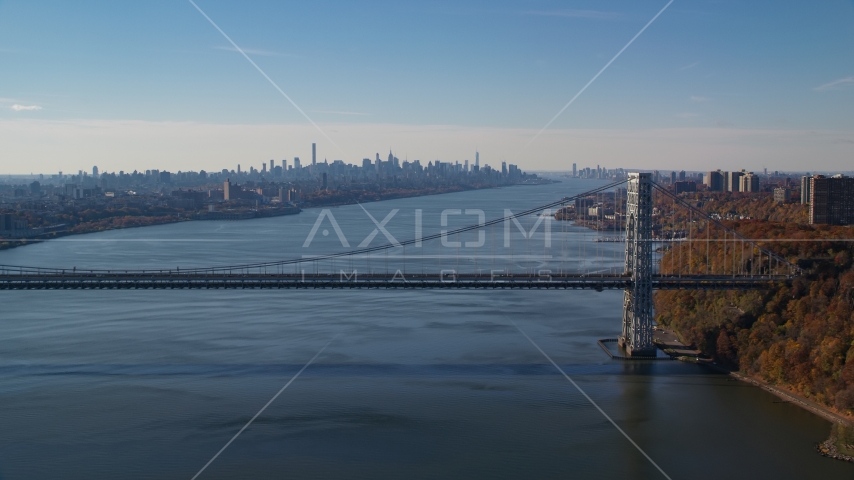 Midtown skyline behind George Washington Bridge, Hudson River in Autumn, New York City Aerial Stock Photo AX119_049.0000046F | Axiom Images