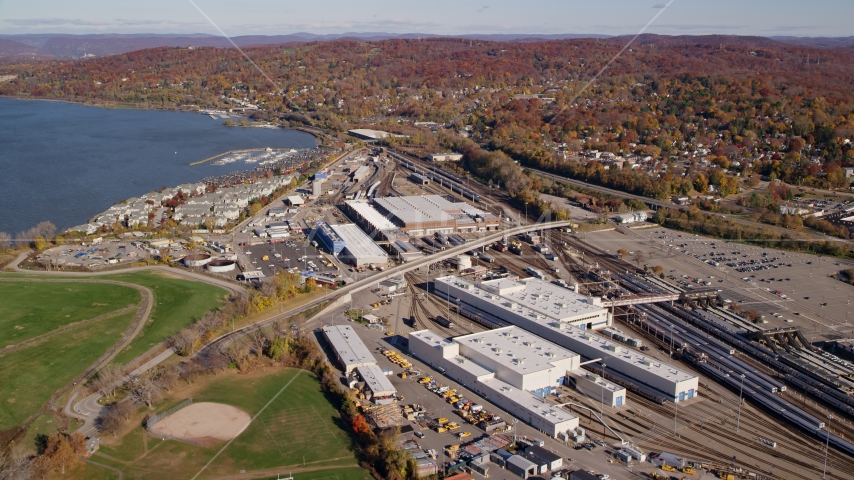 Riverfront rail station in Autumn, Croton on Hudson, New York Aerial Stock Photo AX119_129.0000094F | Axiom Images