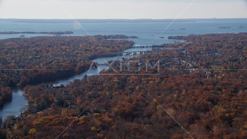 Small town community and bridges over Mianus River in Autumn, Greenwich, Connecticut Aerial Stock Photo AX119_229.0000100F | Axiom Images