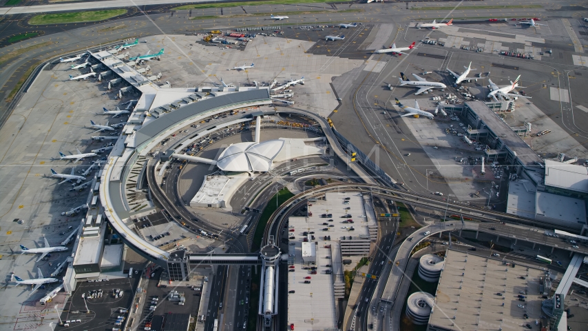 Airliners parked at terminals at John F Kennedy International Airport, New York City Aerial Stock Photo AX120_064.0000220F | Axiom Images