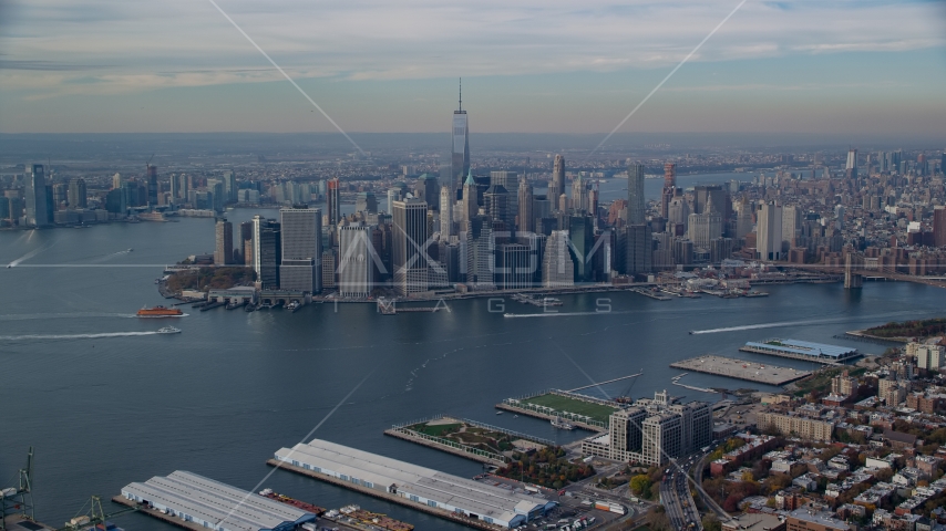 Lower Manhattan skyscrapers and the East River in Autumn, New York City Aerial Stock Photo AX120_089.0000292F | Axiom Images