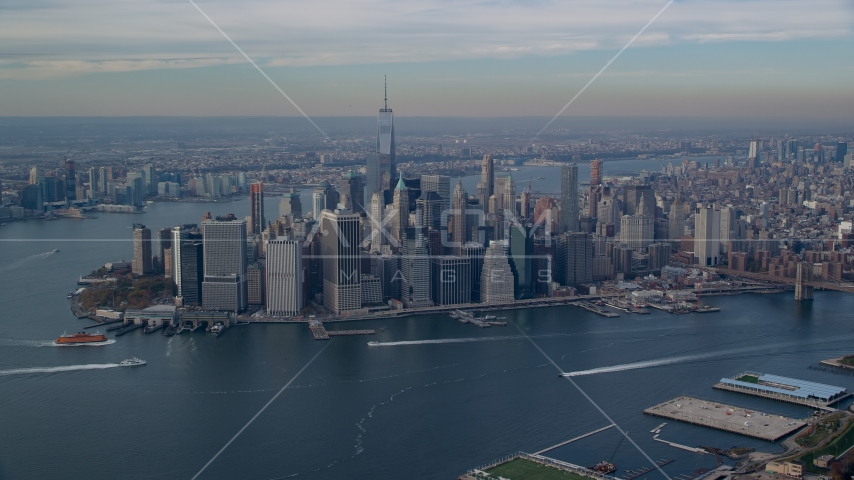 A view of Lower Manhattan skyscrapers across the East River in Autumn, New York City Aerial Stock Photo AX120_090.0000272F | Axiom Images