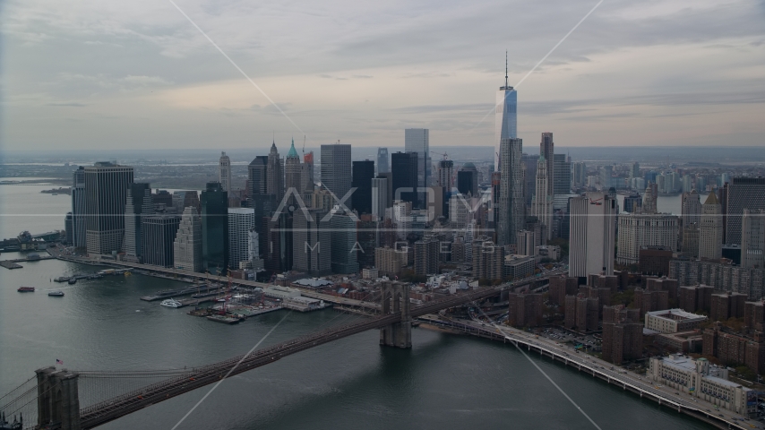 Brooklyn Bridge spanning East River by Lower Manhattan, New York City Aerial Stock Photo AX120_145.0000000F | Axiom Images