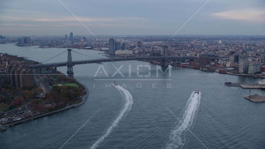 The Williamsburg Bridge and East River at sunset in New York City Aerial Stock Photo AX121_026.0000133F | Axiom Images