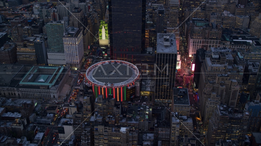 The Madison Square Garden arena at sunset in Midtown Manhattan, New York City Aerial Stock Photo AX121_084.0000279F | Axiom Images