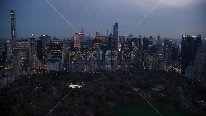 Midtown Manhattan skyscrapers on the edge of Central Park at sunset in New York City Aerial Stock Photo AX121_100.0000107F | Axiom Images