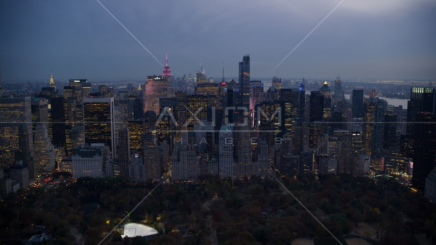 Midtown skyscrapers by Central Park at sunset in New York City Aerial Stock Photo AX121_100.0000241F | Axiom Images