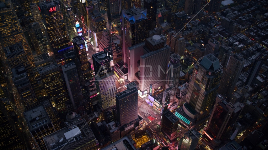 The bright lights and video screens of Times Square at sunset in Midtown, New York City Aerial Stock Photo AX121_105.0000243F | Axiom Images