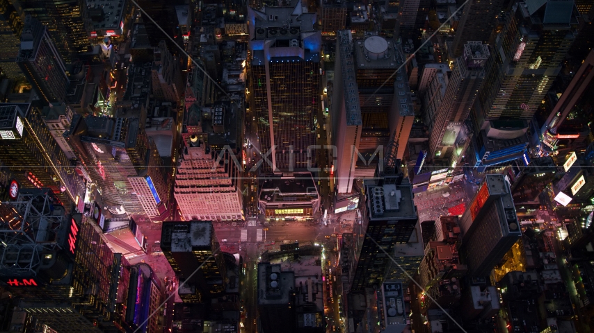 Looking down on Times Square at Sunset in Midtown Manhattan, New York City Aerial Stock Photo AX121_107.0000048F | Axiom Images