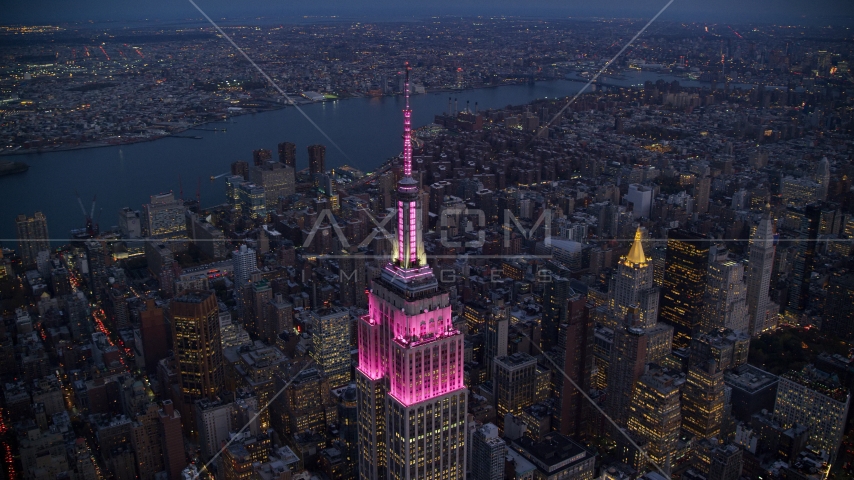 The top of Empire State Building at sunset in Midtown, New York City Aerial Stock Photo AX121_108.0000073F | Axiom Images