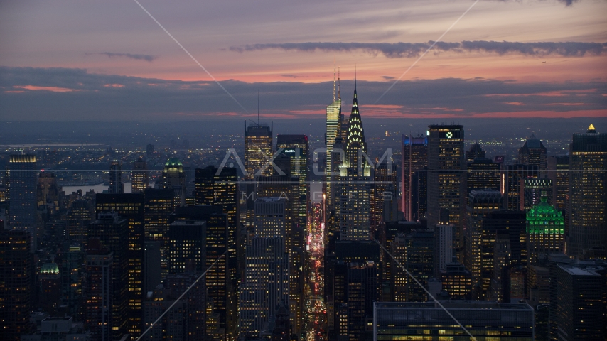 Chrysler Building in front of Midtown skyscrapers at sunset, New York City Aerial Stock Photo AX121_116.0000185F | Axiom Images