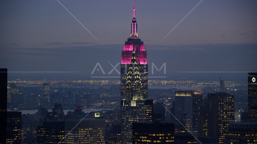 Tops of the Empire State and Chrysler Buildings at sunset in Midtown Manhattan, New York City Aerial Stock Photo AX121_121.0000000F | Axiom Images