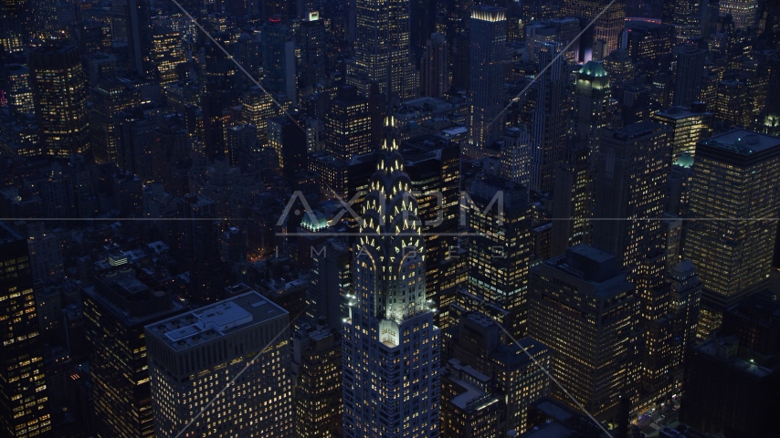 A view of the top of the Chrysler Building at sunset in the Midtown area of New York City Aerial Stock Photo AX121_125.0000243F | Axiom Images