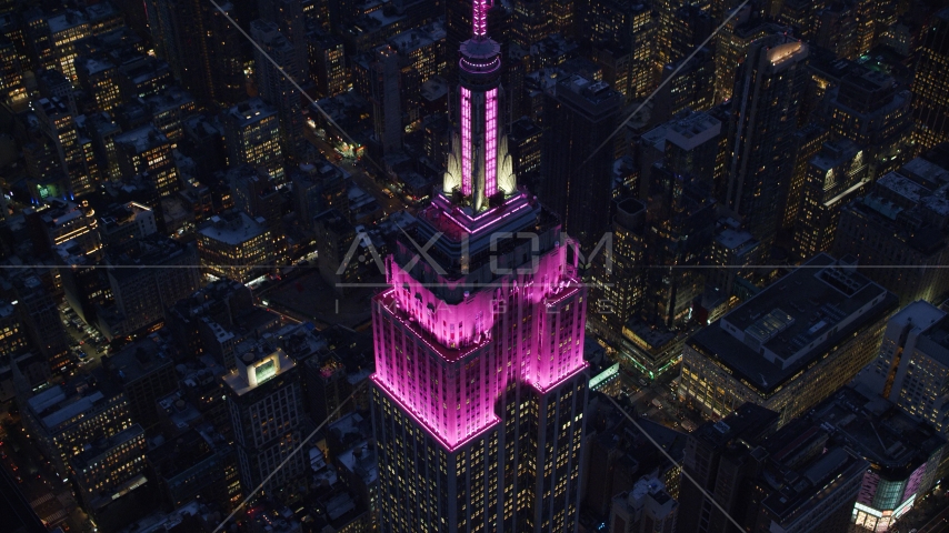 Top levels of the Empire State Building at sunset in Midtown, New York City Aerial Stock Photo AX121_128.0000131F | Axiom Images