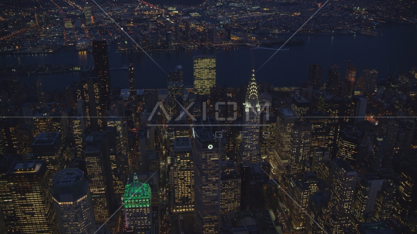 The UN and Chrysler Building and Midtown skyscrapers at night in New York City Aerial Stock Photo AX121_137.0000031F | Axiom Images