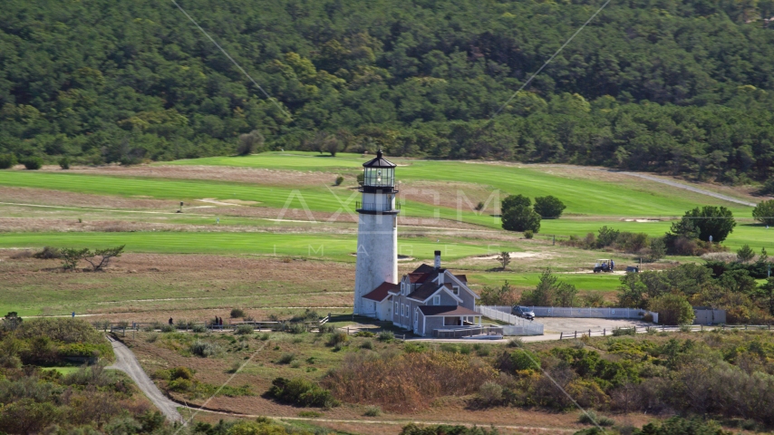 Highland Light near dense forest, Cape Cod, Truro, Massachusetts Aerial Stock Photo AX144_015.0000127 | Axiom Images