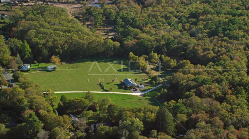 Rural homes and green lawns surrounded by trees, Dartmouth, Massachusetts Aerial Stock Photo AX144_214.0000062 | Axiom Images