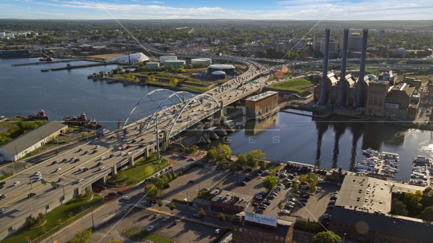 The Providence River Bridge near a power plant with smoke stacks, Providence, Rhode Island Aerial Stock Photo AX145_080.0000262 | Axiom Images