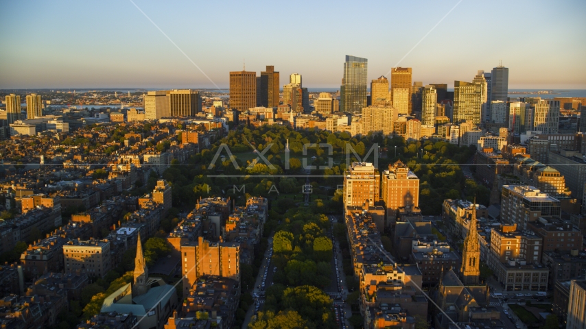 Historic Boston Common and skyscrapers in Downtown Boston, Massachusetts, sunset Aerial Stock Photo AX146_064.0000094F | Axiom Images