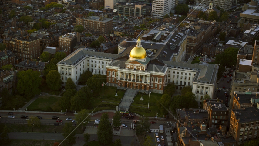 The Massachusetts State House in Downtown Boston, Massachusetts, sunset Aerial Stock Photo AX146_086.0000161F | Axiom Images