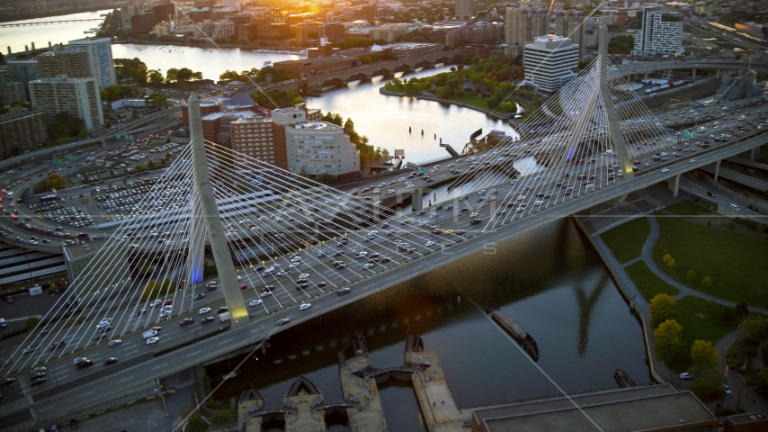 Heavy traffic on the Zakim Bridge at sunset in Boston, Massachusetts Aerial Stock Photo AX146_088.0000269F | Axiom Images