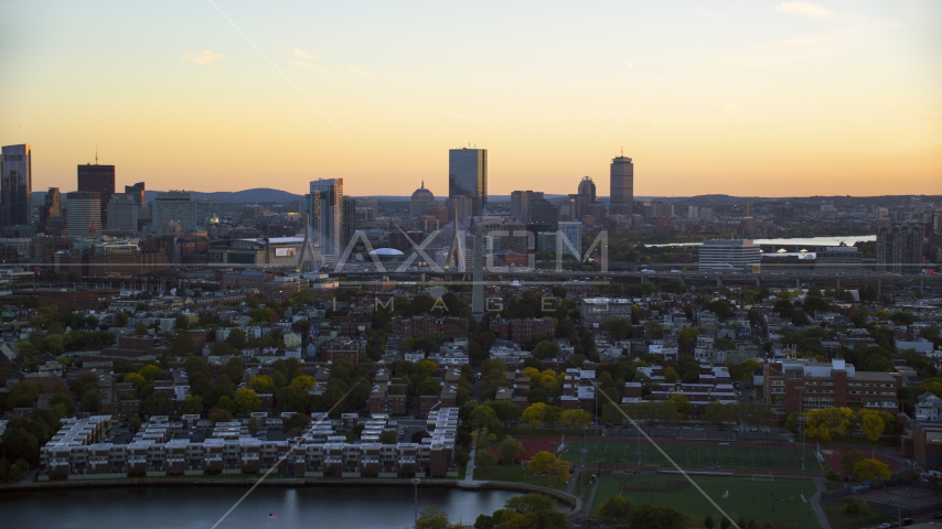 Bunker Hill Monument and waterfront residences, Charlestown, Massachusetts, sunset Aerial Stock Photo AX146_096.0000095F | Axiom Images