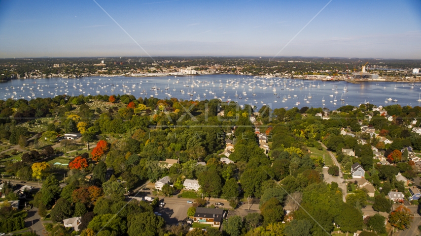 Coastal community in autumn near boat filled harbor, Salem, Massachusetts Aerial Stock Photo AX147_033.0000000 | Axiom Images