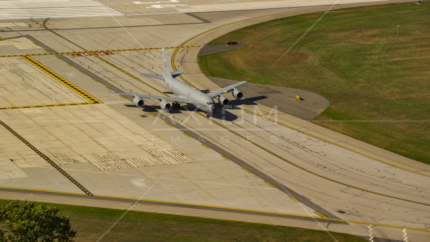 A military plane sitting on runway, Portsmouth International Airport, New Hampshire Aerial Stock Photo AX147_217.0000202 | Axiom Images