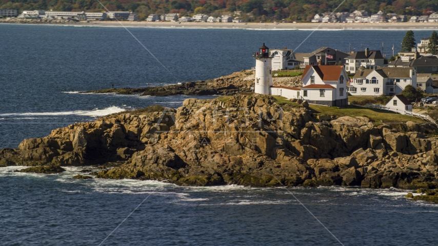 Cape Neddick Light on a rocky shore, autumn, York, Maine Aerial Stock Photo AX147_239.0000000 | Axiom Images