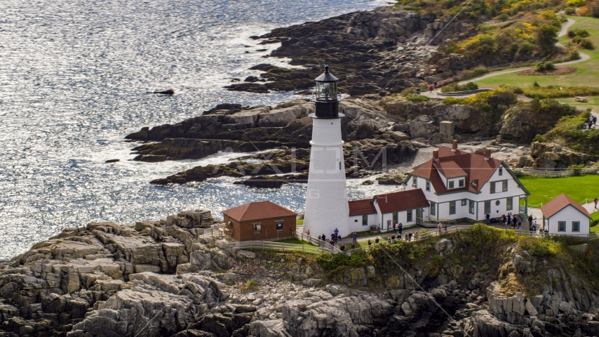 Portland Head Light on a rugged coastline in Cape Elizabeth, Maine Aerial Stock Photo AX147_313.0000156 | Axiom Images