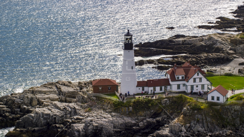 Portland Head Light overlooking the ocean on a rocky coast, Cape Elizabeth, Maine Aerial Stock Photo AX147_313.0000268 | Axiom Images