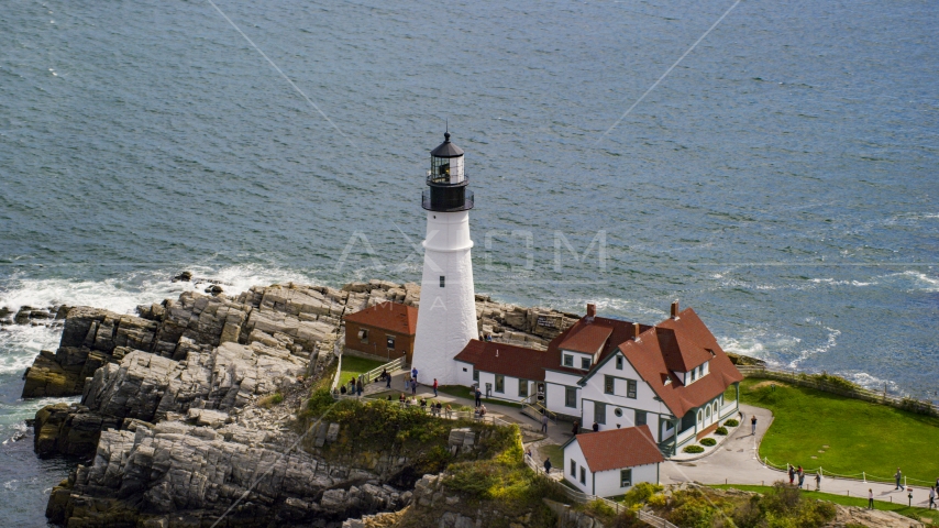 Portland Head Light on the edge of a rocky shore, Cape Elizabeth, Maine Aerial Stock Photo AX147_314.0000147 | Axiom Images