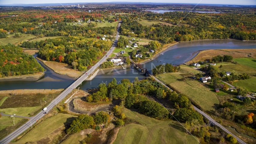 Small bridges, Highway 1 over river near rural homes, autumn, Thomaston, Maine Aerial Stock Photo AX148_067.0000079 | Axiom Images